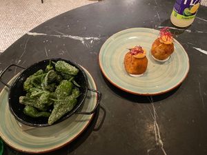 Bomba and grilled peppers  at Velada in Barcelona