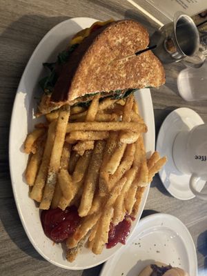 Vegan melt and Truffle fries   at Happy Cafe in Virginia Beach