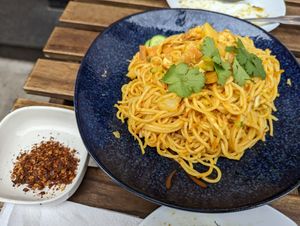Yellow noodles with potato and tofu at Little Myanmar in New York City