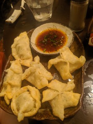 Fried garlic gyoza! He asked our uni degree (environmental science) and shaped the gyozas for an environment theme (Bee, windmill, apple, flower, etc) at Yakuzenshokudo Chabuzen in Tokyo