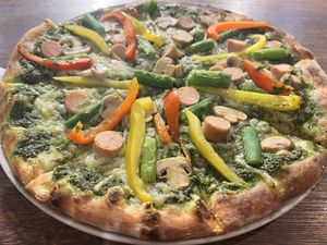 Basil base with Daiya cheese, Zero Meat sausage, peppers, mushrooms, and asparagus  at Pizza Cucinova in Tokyo