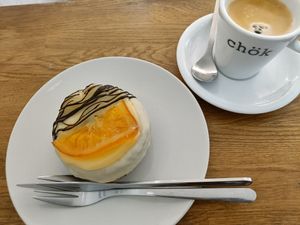Cronut with orange topping and Americano at Chök - Valencia in Valencia