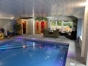 Pool, saunas wet-room and seating area at OakleyWales in Newcastle Emlyn