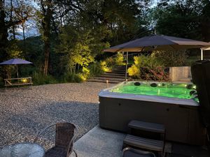 Hot-tub next to pool facilities  at OakleyWales in Newcastle Emlyn