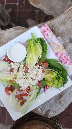 Wedge Salad
romaine lettuce, cherry tomato, bacon, bleu cheese crumbles, bleu cheese dressing at V-Spot in New Hope