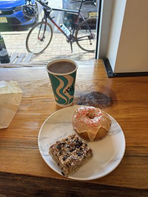 Pumpkin glazed fried doughnut, mixed nut and coconut bar and a cup of filter coffee  at All Roads in Jefferson