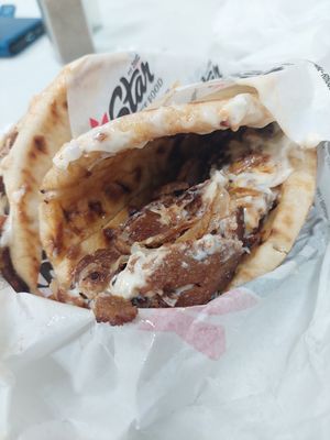 It looks bad because it was delivered at work but it's delicious at Star Fast Food in Rhodes