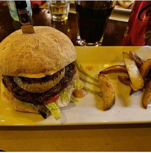 Panino veg a base di burger di lenticchie, cipolle, insalata e salsa alle zucchine at La Cantina Degli Spiriti in Iglesias