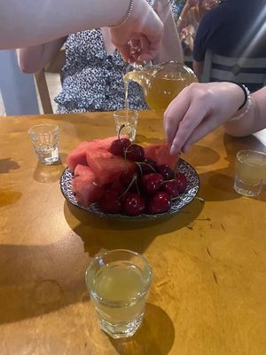 Jug of raki and fresh fruits  at Anemi Taverna in Crete