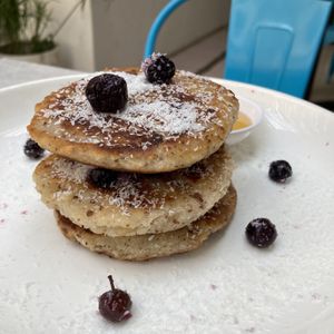 Coconut pancakes with berries  at Planta in Phnom Penh