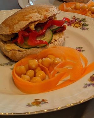 Hummus sandwich with sun-dried tomatoes and fresh vegetables at Café Hyggestund' in Birkeroed