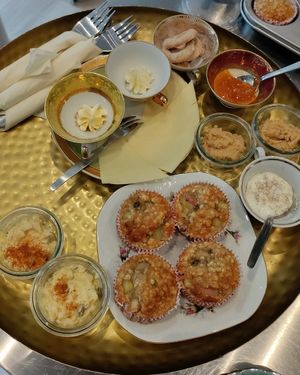 A brunch platter with baked oats, hummus, egg salad and butter (as spreads for the homemade bread also served) at Café Hyggestund' in Birkeroed