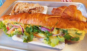 Apple raisin cake, croissant, curry chicken sandwich at Origin - Coffee Shop Végétal in Strasbourg