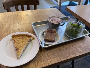 tarte a l'oignon, brownie and a cappuccino   at Origin - Coffee Shop Végétal in Strasbourg