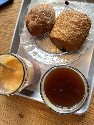 beignet, pain au chocolat, iced coffee and fresh juice (pommes, carrote and cassis)  at Origin - Coffee Shop Végétal in Strasbourg