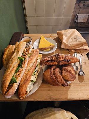 3 sandwichs différents, un croissant fourré chocolat, cinnamon roll, tarte citron at Origin - Coffee Shop Végétal in Strasbourg