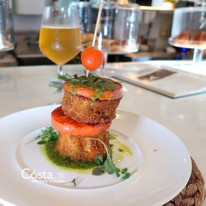Garden Stack: Crispy Eggplant, Heirloom Tomato, Creamy
Pesto, Basil Emulsion at Cósta by OK&M in Delray Beach