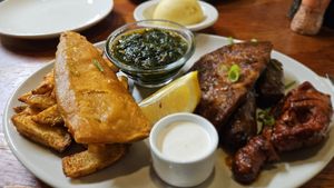 Chips, fish, spinach, steak, sausage, wing (and fufu in the background) + lemon and mayonnaise at Romeo and Vero Vegan Butcherie and Restaurant  in Cape Town