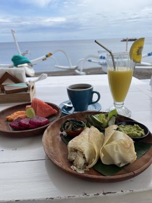 Breakfast burrito with juice, coffee, and fruit add-on  at SALT in Amed