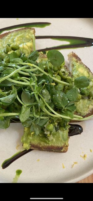 pea and greens on avocado toast w/lemon very good, summer seasonal option  at Nemesis in North Vancouver