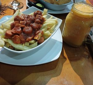 Salchipapa, 7/10 y mezcla maracu-mango 8/10 at Vegarden in Medellin