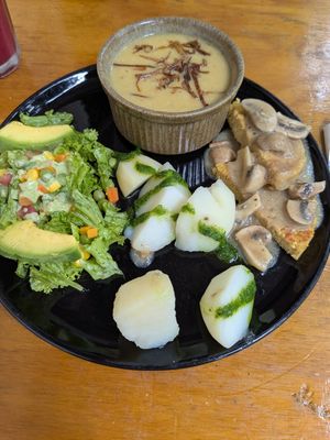 Meal of day: salad, potatoes, soup, garbanzo burger at Vegarden in Medellin