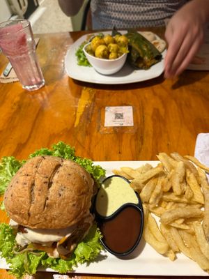 Hamburguesa Vegarden with fries, Tamal Criollo at Vegarden in Medellin