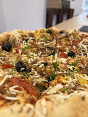 Pizza with cheese in crust 11€   at Veganicelos in Setubal