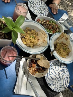 Family lunch on terrace looks like this. Dish of the day 7€, salat of the day 5€, natural juice of the day 2€  at Veganicelos in Setubal