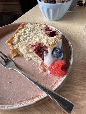 Raspberry and blueberry cake with icing  at Brew & Brownie in York