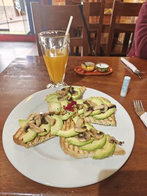 Avocado and garlic mushrooms on toast. Ask to be made without butter. at JC's Cafe in Cusco