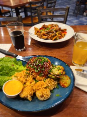 Both entrées are from their seasonal specials: roasted cauliflower with spicy Korean sauce with sticky rice balls and kimchee and a roasted squash Buddha bowl with seitan at Home Grown Cafe in Newark