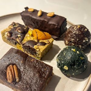 Snickers and muesli bar, pecan almond slice, brownie and pistachio + spirulina energy ball  at Wyld Berry in Mallorca
