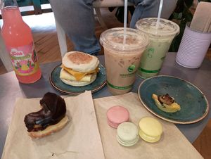 Donut, breakfast sandwich, cardamom soy latte, matcha oat latte, and macarons at Logan Vegan  in Chicago