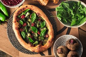 Vegan sun-baked tomato and basil pesto pizza, can be made glutten-free! at People of Tomorrow in New Delhi
