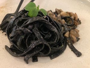 CHARCOAL FETTUCCINE
Black Ribbon Pasta, Portobello, Shiitake, Parsley, Confit Garlic, Wild Mushroom Dust at People of Tomorrow in New Delhi