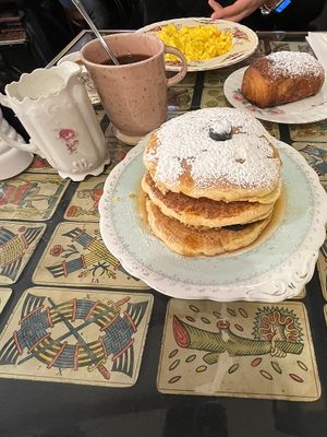 Pancakes with berries, banana and maple syrup + a coffee with warm soy milk   at Coromandel in Rome