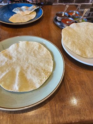 Poppadoms, Namaste Navratan, Aloo Bonda and steamed rice. at Namaste Village Cambridge in Cambridge