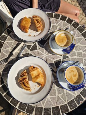 Cinnamon bun, pan au chocolate and coffee! at All Things Dough in Lagos
