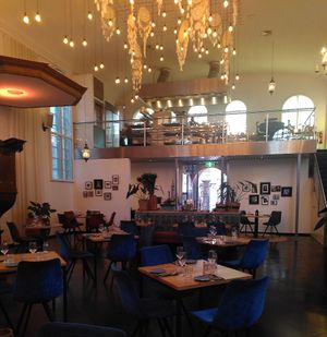 Very cosy indoor setting and view on the kitchen located where the church choir used to perform at Restaurant Oost in Roosendaal