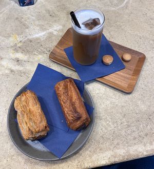 Sausage roll, pain au chocolat, cold brew with oat milk  at WAY Plant Based Bake House in Ghent