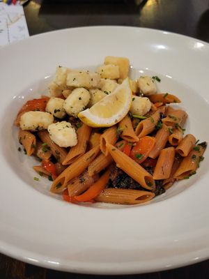 Chef's vegan creation for us - red lentil pasta, fried tofu, maitake mushrooms, peppers, cherry tomatoes at Down Island Gulf Seafood Restaurant in Santa Rosa Beach