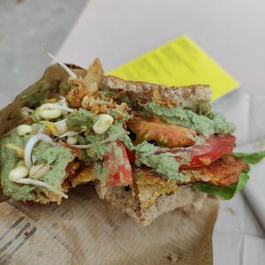 Vegan and bio sandwich made with fresh vegetables, lentil burger, sprouts, green pesto and lentil burger. at Linsenmanufaktur in Kassel