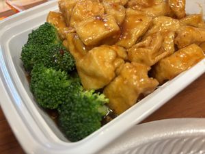 General Tso’s tofu with takeout container and styrofoam plate   at Ruby Cafe in Bethlehem