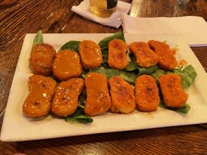 Vegan nuggets with buffalo and gold sauces  at Pizzetta in Mystic