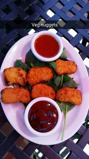 ";Chicken Nuggets"; with sweet chili sauce and BBQ. So fun to have options that resemble ";normal"; food options.  at Pizzetta in Mystic