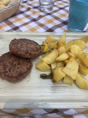 100% vegan burger with potatoes   at Anca Massa in Lido Di Jesolo