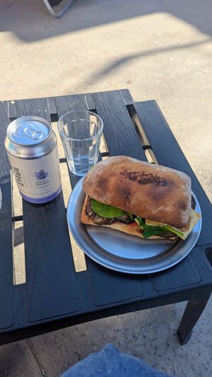 Kombucha y sandwich de berenjena con tofu en vez de queso at Hola Chola Garage in Buenos Aires