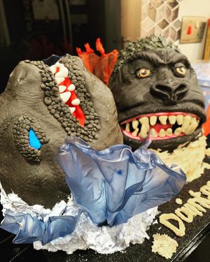 Monster Godzilla vs Kong hand carved birthday celebration cake, made with vanilla sponge, buttercream, fondant and rice paper - all edible   at The Tree Rooms in Peterlee