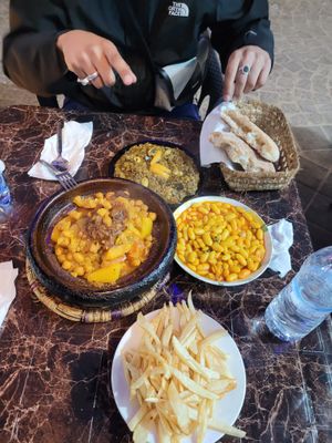 Vegetable tajine, eggplant salad (with olives and lemon), white beans, French fries (don't order them, they're raw)  at Chez Omar in Essaouira